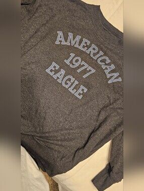 American Eagle Dark Charcoal Pullover with Light Beige Tag Detail